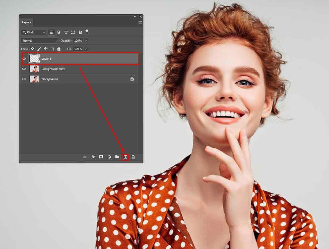 create-high-contrast-check-layer Photoshop Layers panel with a new blank layer created above the duplicated portrait layer.
