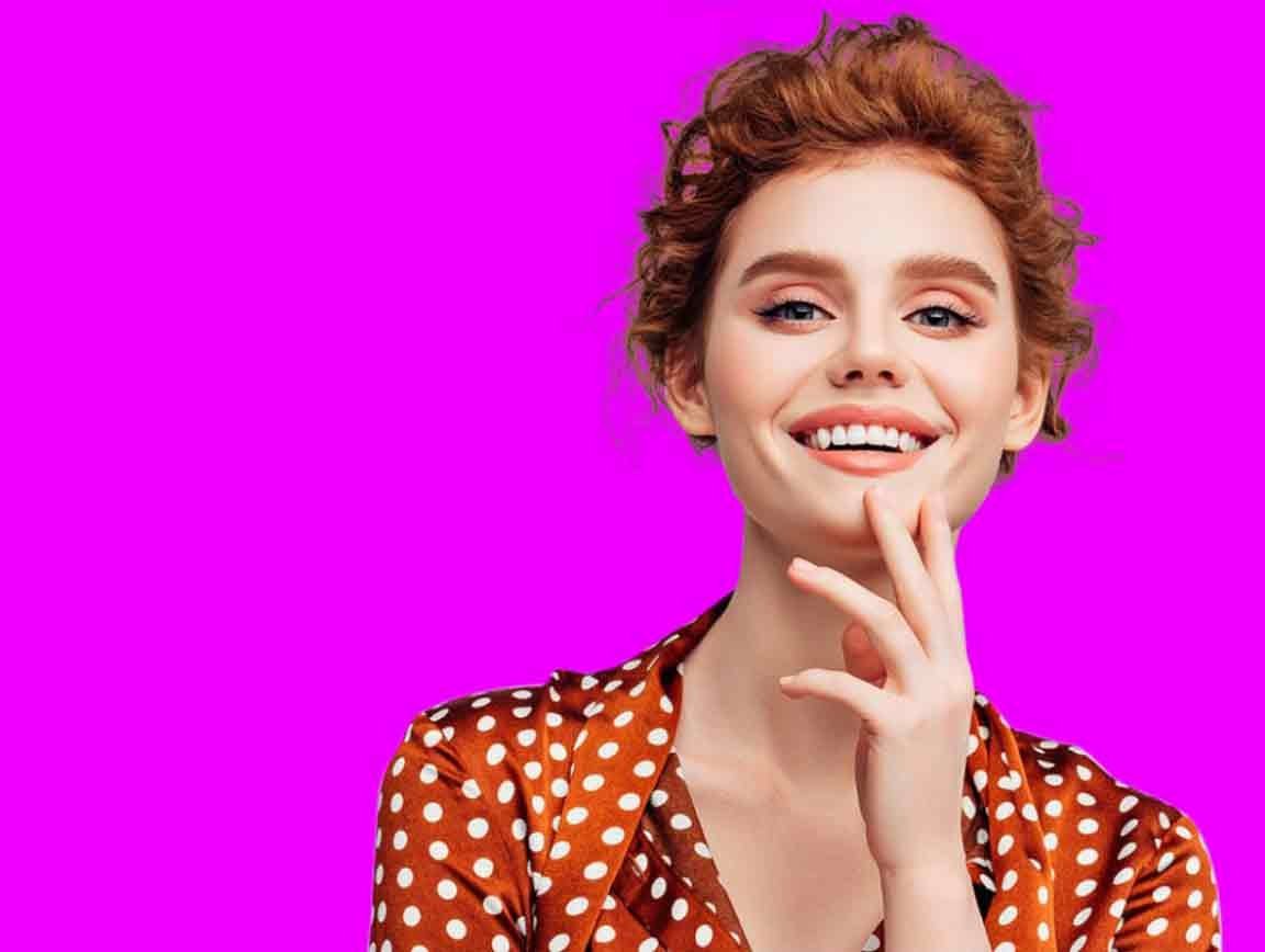 fill-background-color-behind-hair Portrait displayed over a solid magenta background layer after the original background was removed.