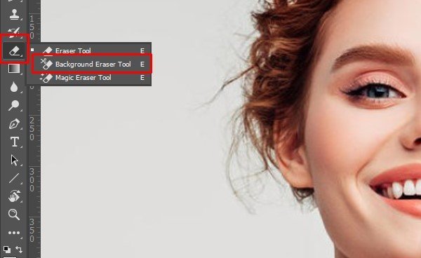 photoshop-background-eraser-tool Photoshop toolbar menu with the Background Eraser Tool selected beside the portrait.