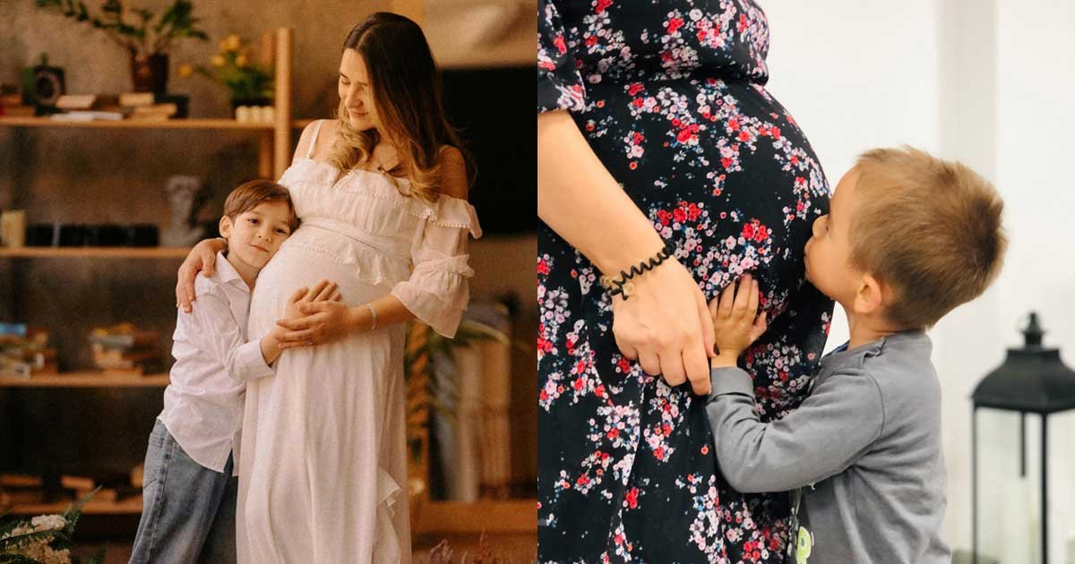 Young child hugging and kissing a pregnant mother’s baby bump during a warm family maternity photoshoot indoors