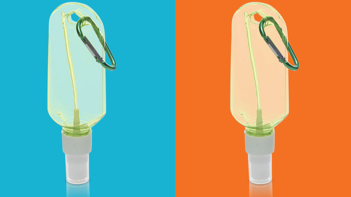 Transparent travel hand sanitizer bottle with clip shown on colorful backgrounds after image masking.